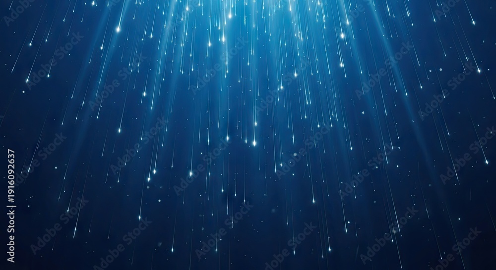Obraz premium Dark Blue Background with Falling Blue and White Glittering Particles Descending from Above Creating a Mystical and Celestial Atmosphere of Light Rays