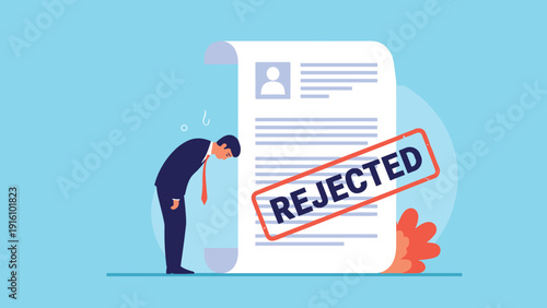Disappointed job applicant bows his head in sadness next to a large resume document marked with a red rejected stamp.