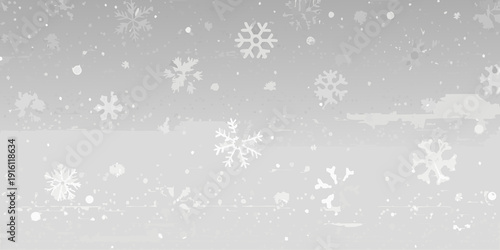 Falling snowflakes against a gray winter background with a blurred silhouette