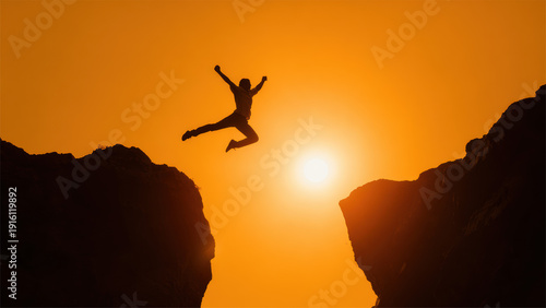 Silhouette Of Brave Man Jumping Across Cliff At Sunset Symbolizing Risk Freedom And Success