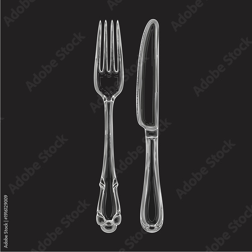 Elegant Silver Fork and Knife Set on Black Background.