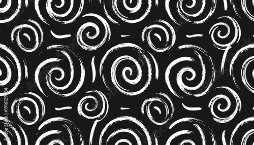 Swirling patterns of white spirals and lines on a black background, viewed from directly above, showcasing a graphic design