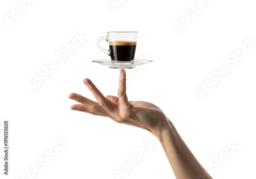 close-up of a bare caucasian hand elegantly balancing a clear glass demitasse cup with rich espresso and crema, isolated on transparent for copy space, concept of premium coffee service