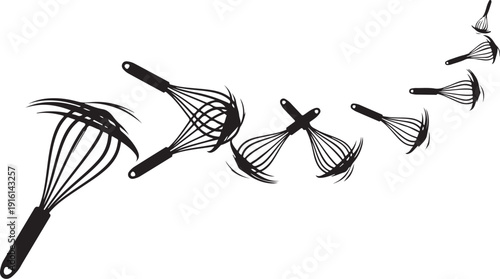 Whisks in Motion on White Background with Blurred Effect