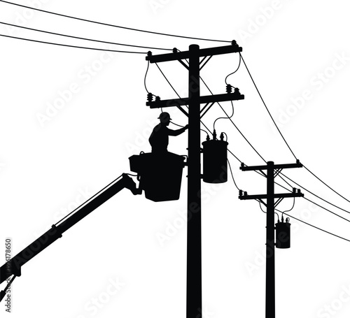 Silhouette of worker in bucket truck servicing electrical transformer on power pole lineman power line