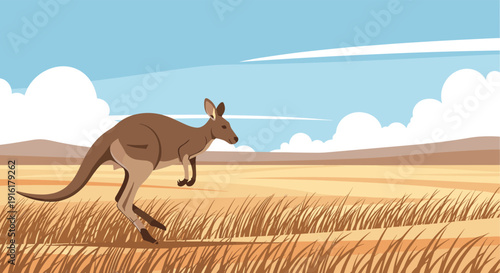 A brown kangaroo hops across a dry, grassy field with distant hills under a vast blue sky with fluffy white clouds.