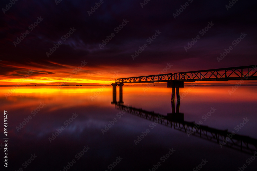 Obraz premium Bridge at Sunset with Golden Sky