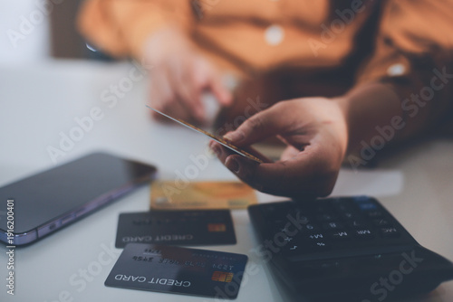 Tableau sur toile Online payment, Hands of woman holding a credit card and using smart phone for o