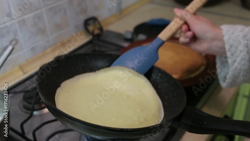 Flipping a Crepe on a Gas Stove