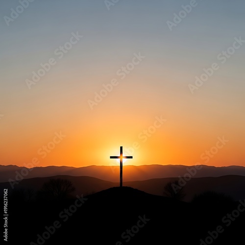 A serene landscape of a cross on a hill at sunset with mountains in the background.