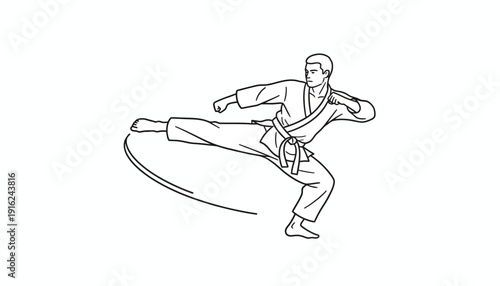 Karate practitioner performing a dynamic side kick in a dojo, martial arts training, action shot