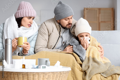 Ill family in winter clothe...