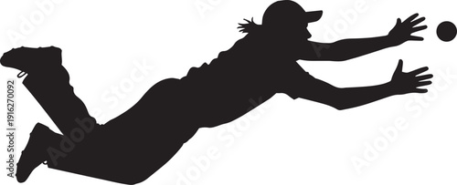 Silhouette of a soccer goalkeeper diving to catch a ball