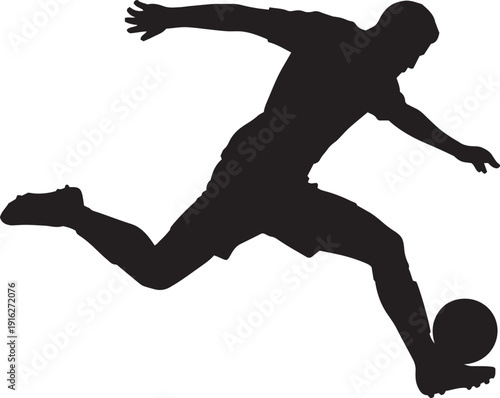 Soccer player kicking a ball in motion