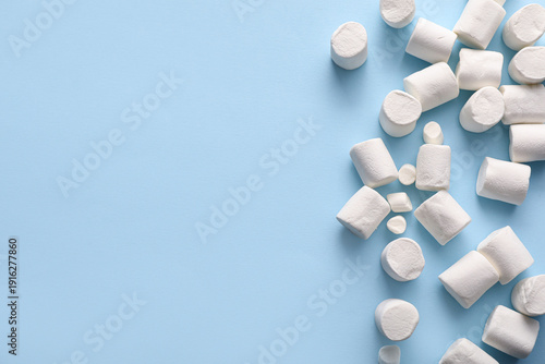 Sweet marshmallows on blue ...