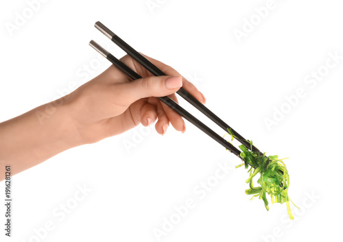 Young woman holding chopsti...