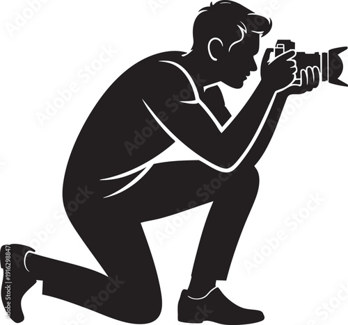 Silhouette of photographer kneeling, taking photo with professional camera