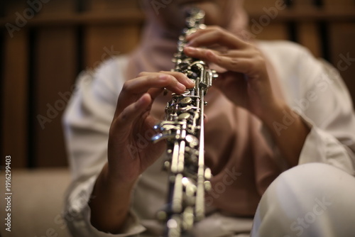 Photos Close Up of Musician Playing Oboe