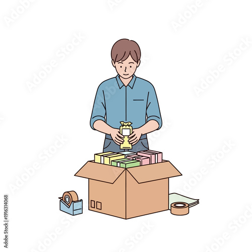 Man packing gift boxes in a cardboard box, preparing for shipping or delivery