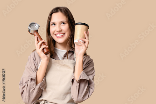 Happy young female barista ...