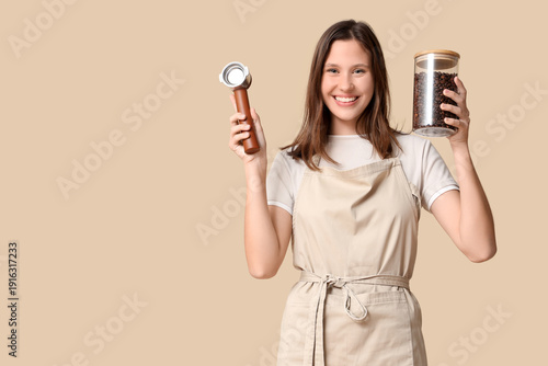 Happy young female barista ...