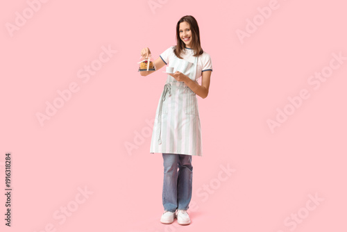 Happy young female barista ...