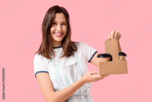 Happy young female barista ...