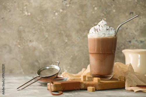 Glass of cold cocoa drink w...