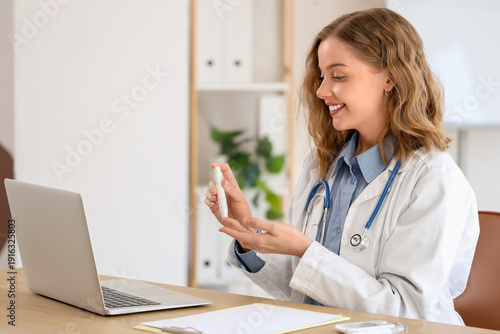 Female doctor with lancet p...