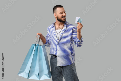 Stylish young man with shop...