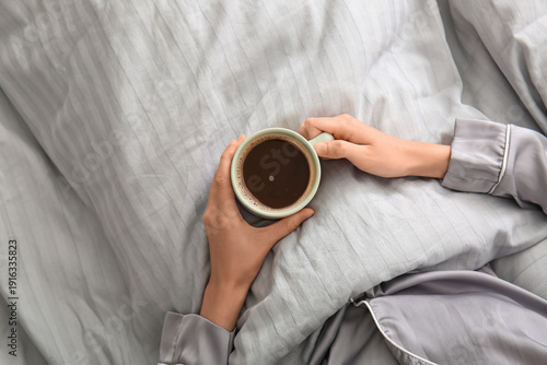 Young woman with cup of cof...