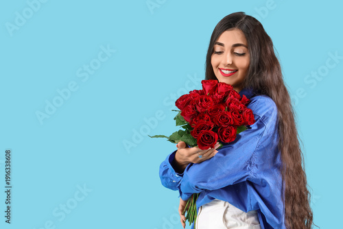 Happy young woman with bouq...