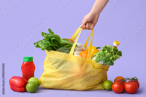 Female hand holding eco bag...