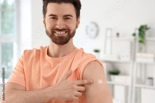 Young man pointing at appli...