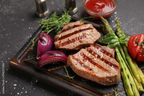 Tasty grilled steaks with v...