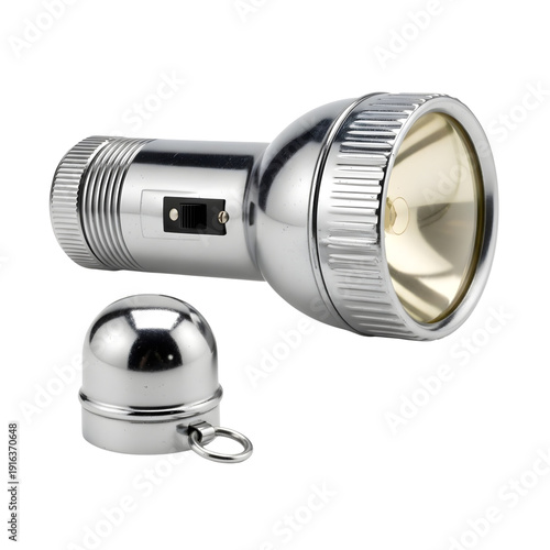 Close-up of a silver flashlight with removable cap on a plain surface