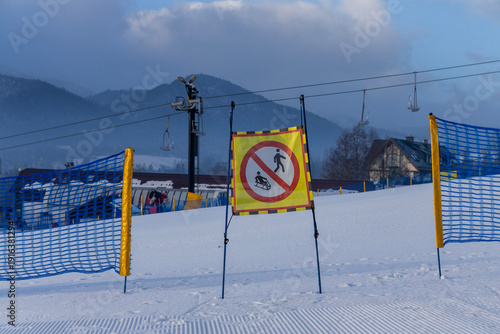 Prohibitory sledding sign. Ski resort in Poland Zakopane. Polana Szymoszkowa