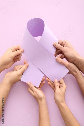 Hands holding paper awarene...