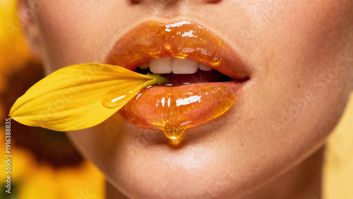 Wallpaper Mural Honey-Kissed Petal: A close-up of luscious, glossy lips, adorned with a sunflower petal, evokes a sense of natural beauty and golden sweetness. Torontodigital.ca