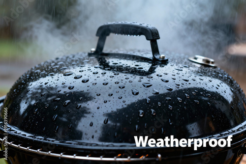 Steamy Grill in the Rain: A close-up view of a wet, black grill lid steaming gently in the rain, highlighting its weatherproof design and ability to withstand the elements.