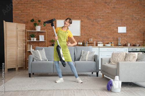 Pretty young woman with vac...