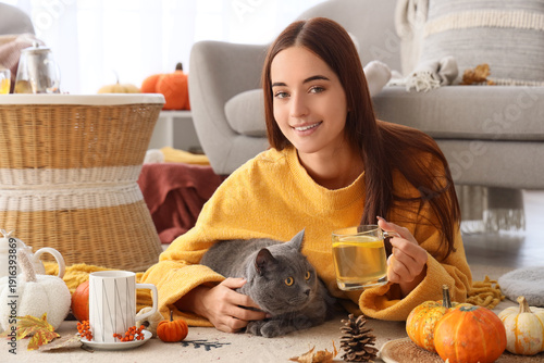 Young woman with cup of tea...