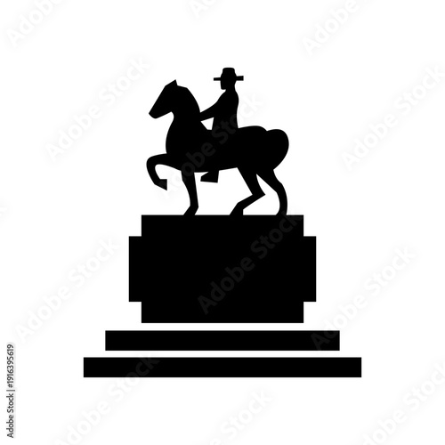 Silhouette of a man riding a horse on a pedestal monument.