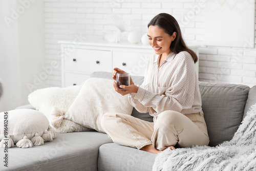 Happy young woman with glas...