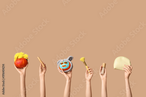 Women holding funny pumpkin...