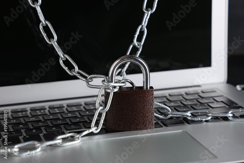 Padlock with chains on lapt...