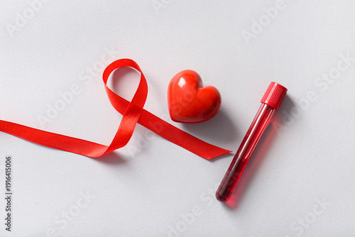 Red ribbon with heart and b...