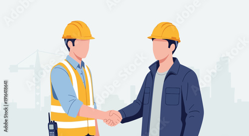 Two dedicated construction professionals in hard hats shaking hands, symbolizing a successful business partnership and agreement in the building industry, teamwork concept