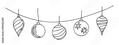 Decorative Christmas ornaments hanging in a line creating a festive holiday atmosphere suitable for seasonal greetings and winter celebrations