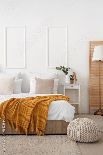 Interior of light bedroom w...